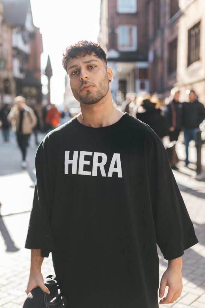 Man in Black Crew Neck T-shirt Standing on Street